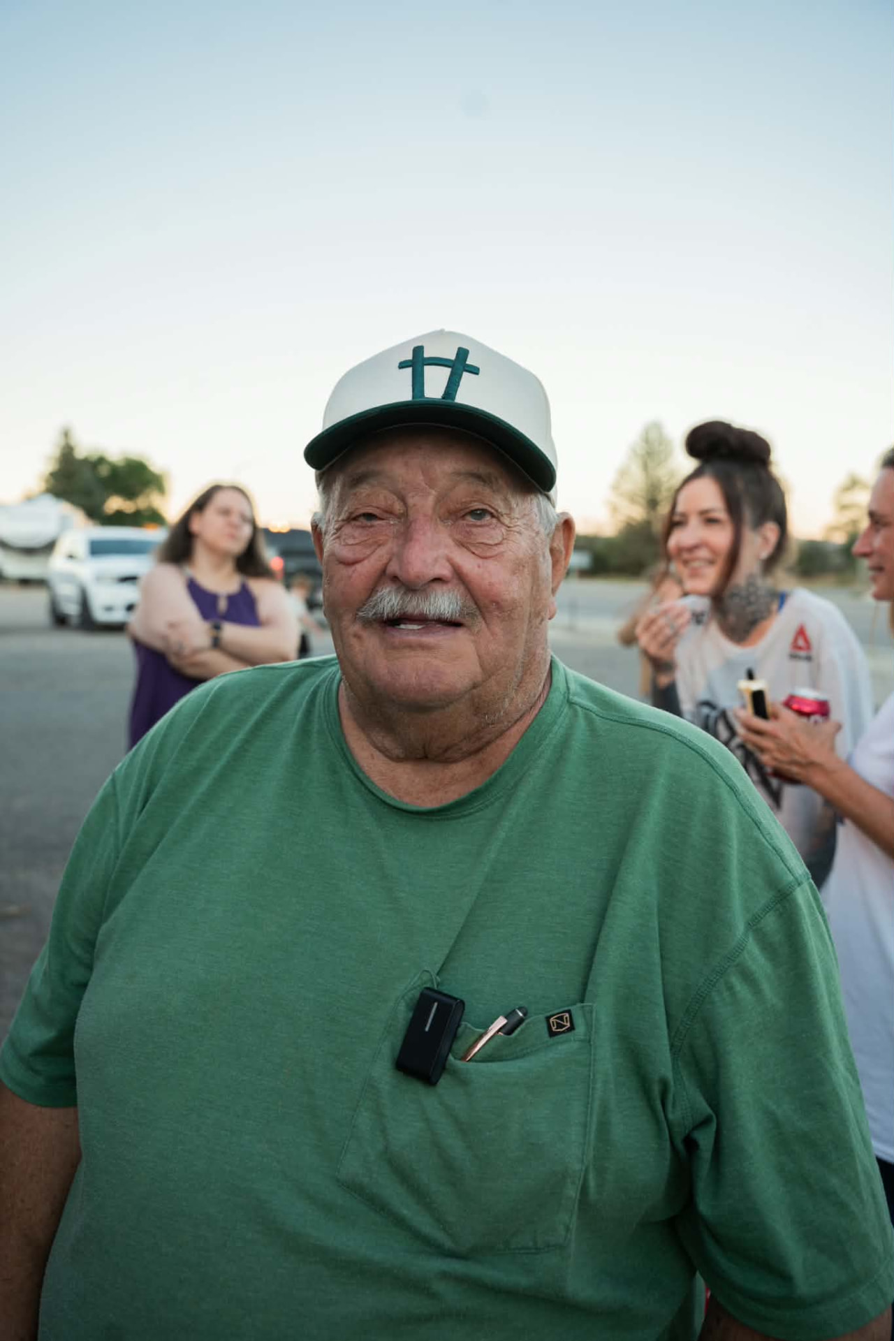 Jim Bassett in his green shirt and 3-H cap